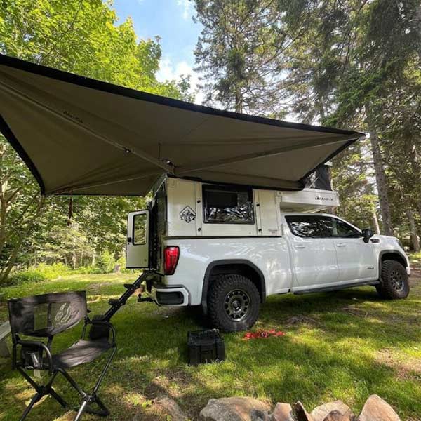 OEV Back Country 6.85 slide-in camper on truck