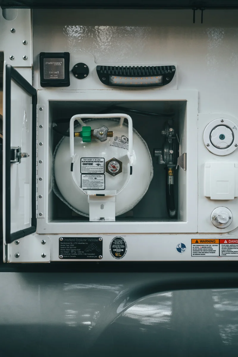 Back Country 6.85 propane cabinet interior from above showing tank and regulator