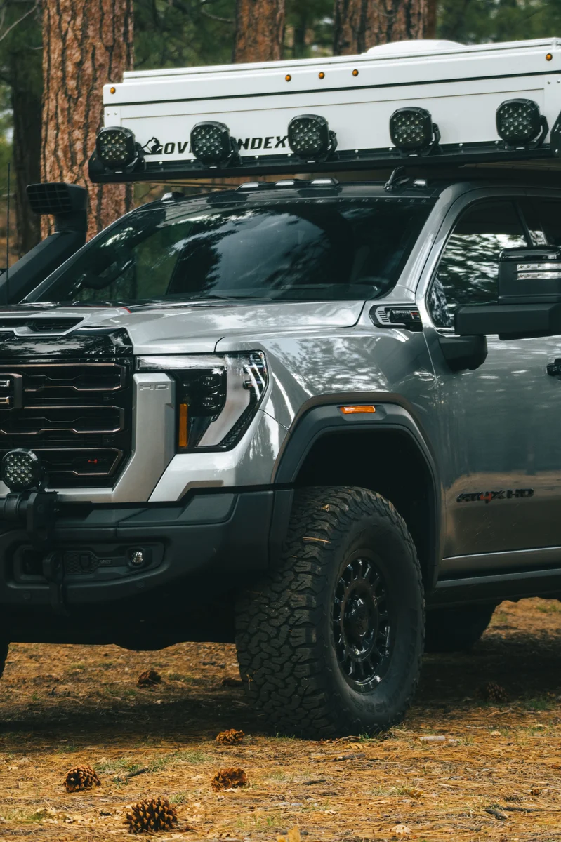 Back Country 6.85 front driver-side portrait showing roof rack with lights and Back Country badge