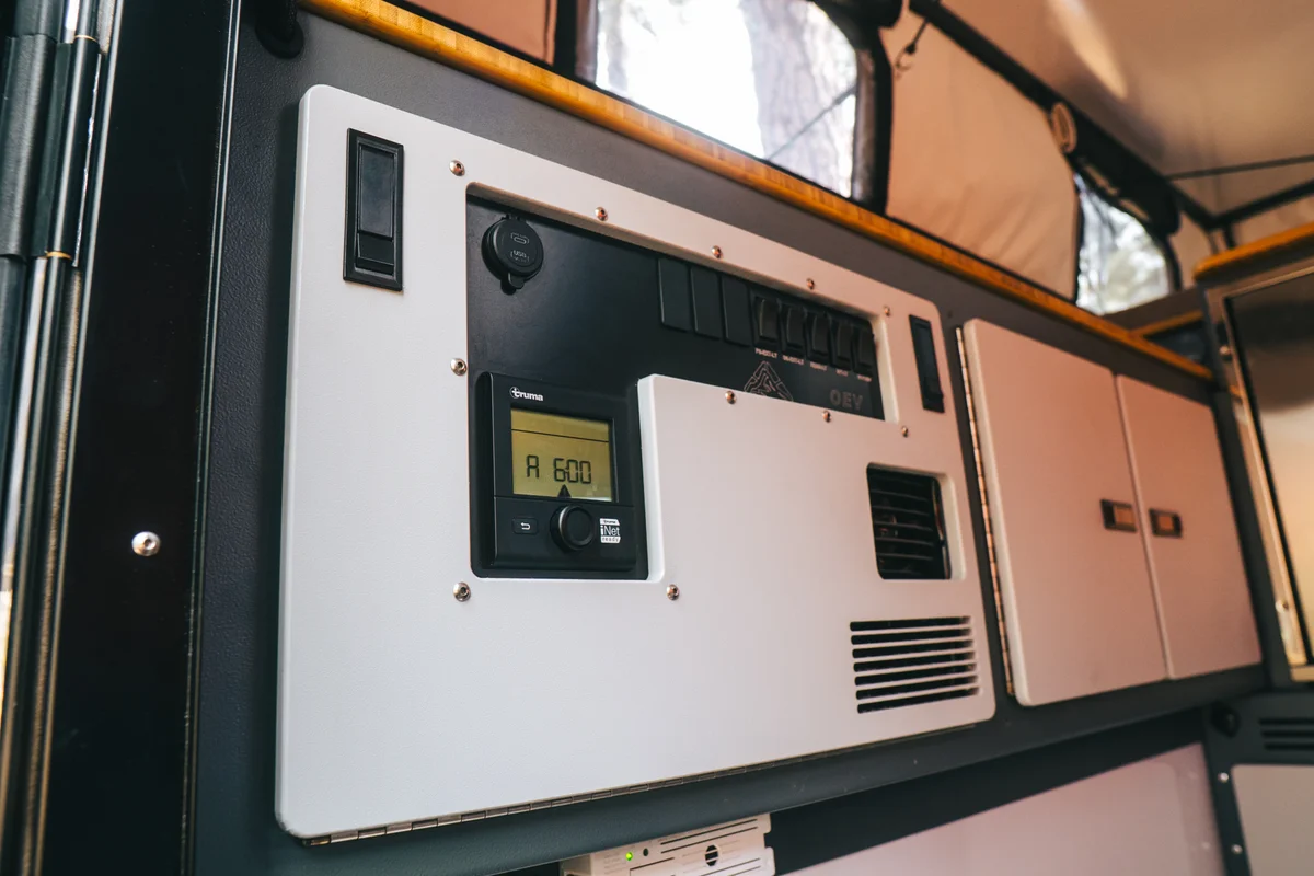 Back Country 6.85 interior control panel showing Truma iNet thermostat, OEV labeled rocker switches, and Truma Vario heater